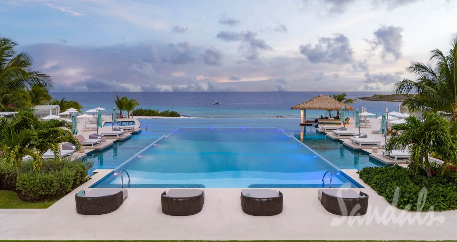 Sunset over the infinity pool at Sandals Royal Curaçao