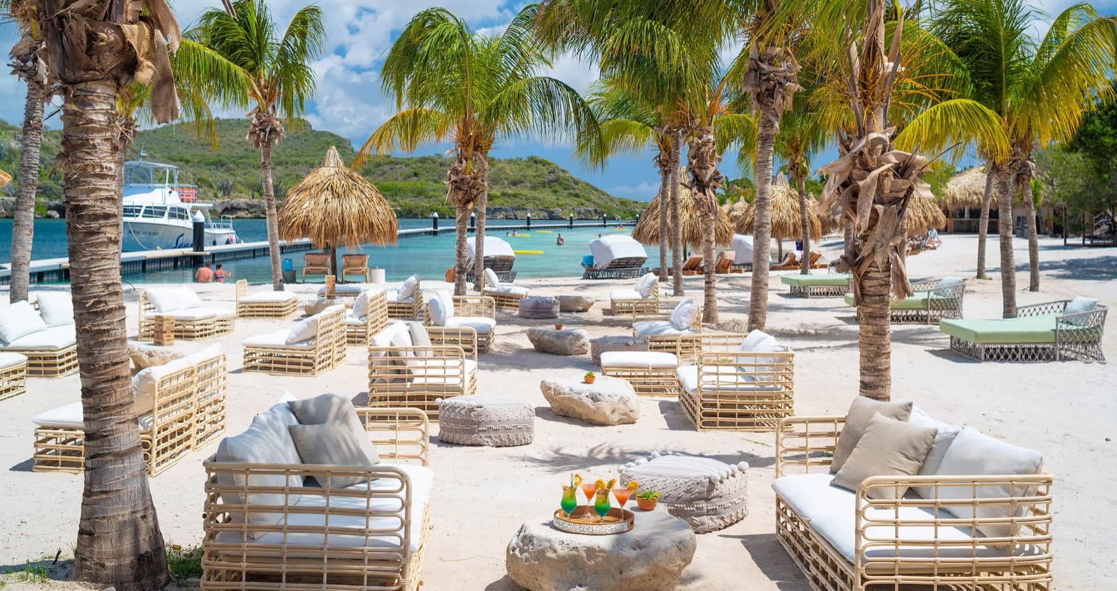 Beachfront cabanas under the palms at a Sandals resort