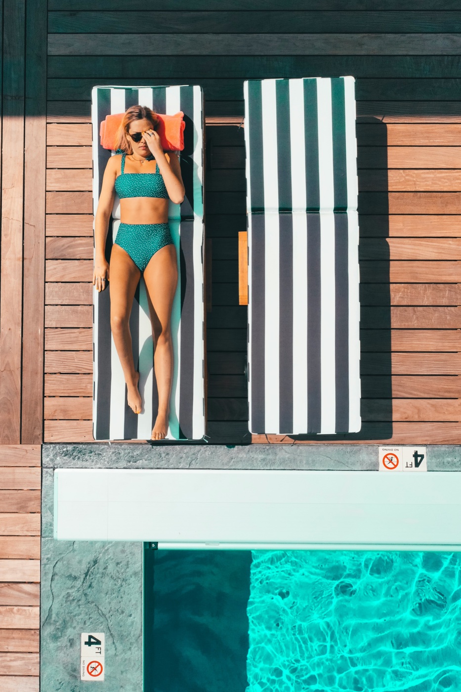 Poolside lounger in the sun, seen from above