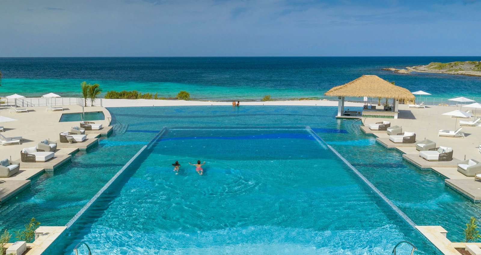 Infinity pool meeting the Caribbean at a Sandals resort