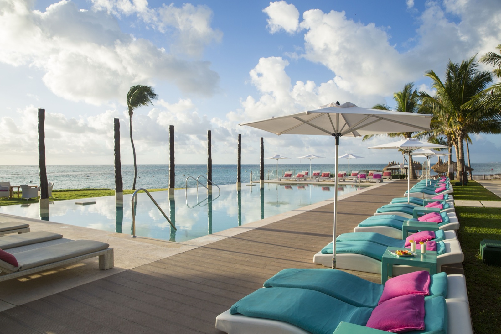 Lagoon-side infinity pool and loungers
