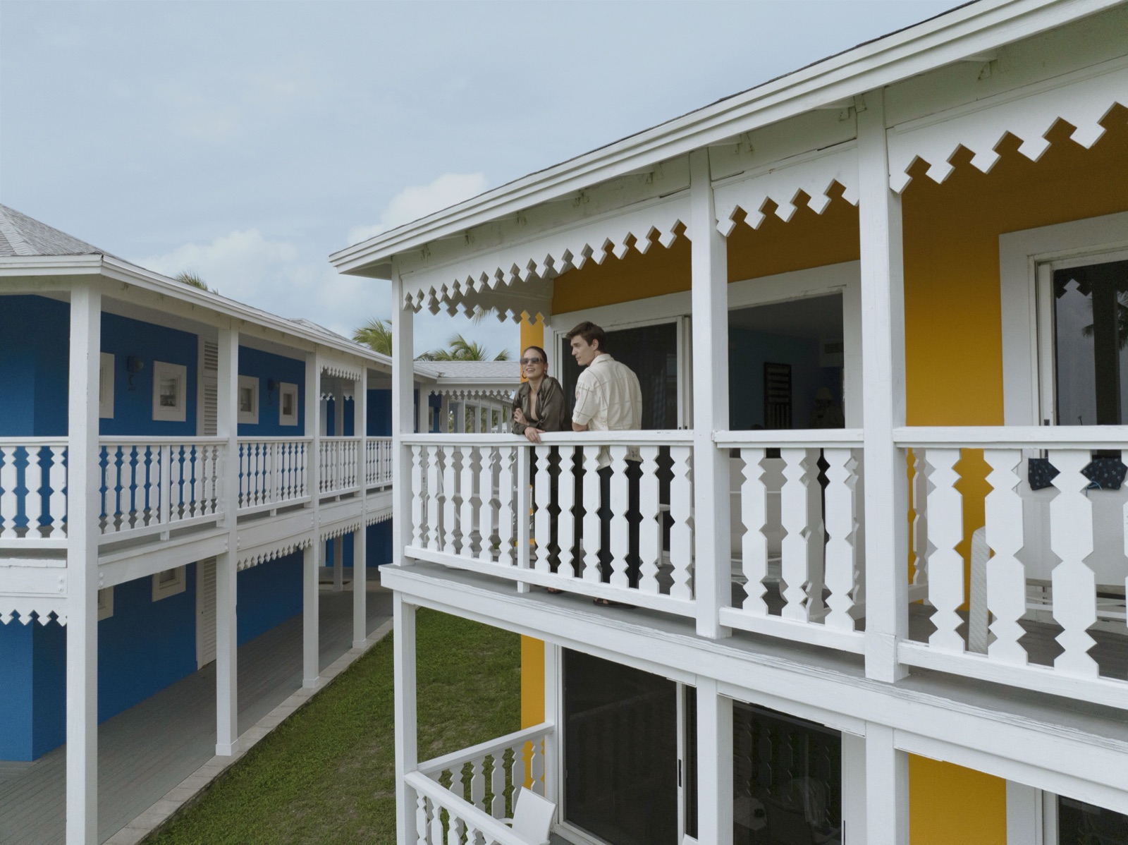 Gingerbread balconies on the blue and yellow bungalows