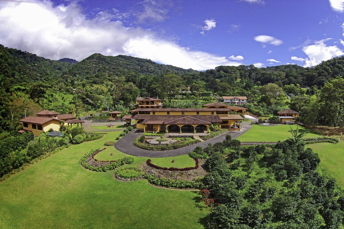 Aerial view of Los Establos Boutique Resort, terracotta roofs and gardens set in the green highlands of Boquete, Panama