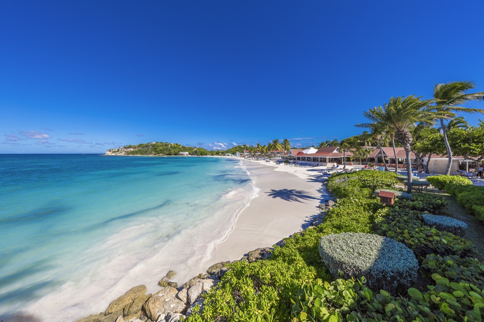 White-sand beach and turquoise water at Pineapple Beach Club