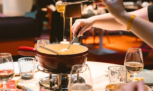 A bubbling Swiss cheese fondue on the table at The Grischa, the resort's main restaurant