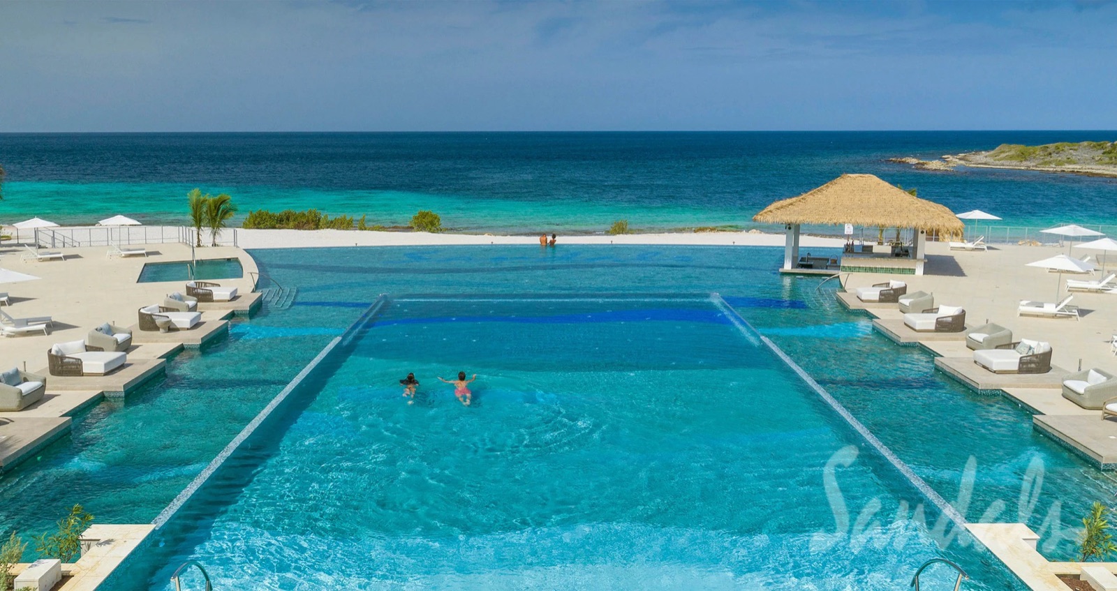 The Dos Awa two-level infinity pool at Sandals Royal Curaçao, looking out over the Spanish Water